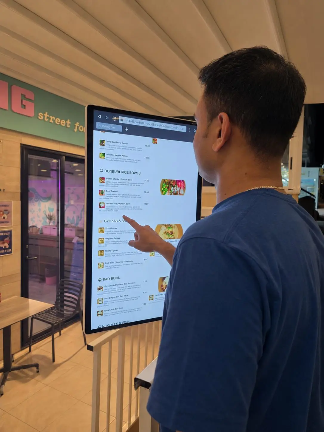 Self-ordering kiosk on the walkway outside Peking.